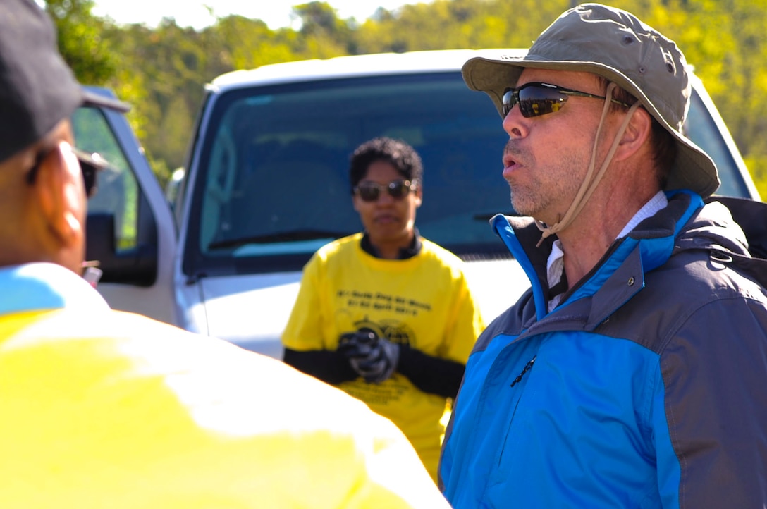 Tim Christensen, 733rd Civil Engineer Division environmental and natural resources specialist, briefs community members before a shoreline planting activity at Fort Eustis, Va., April 23, 2014. Each year, volunteers plant new shoreline grass to prevent erosion, which preserves the more inland habitats at Fort Eustis. (U.S. Air Force photo by Senior Airman Austin Harvill/Released) 