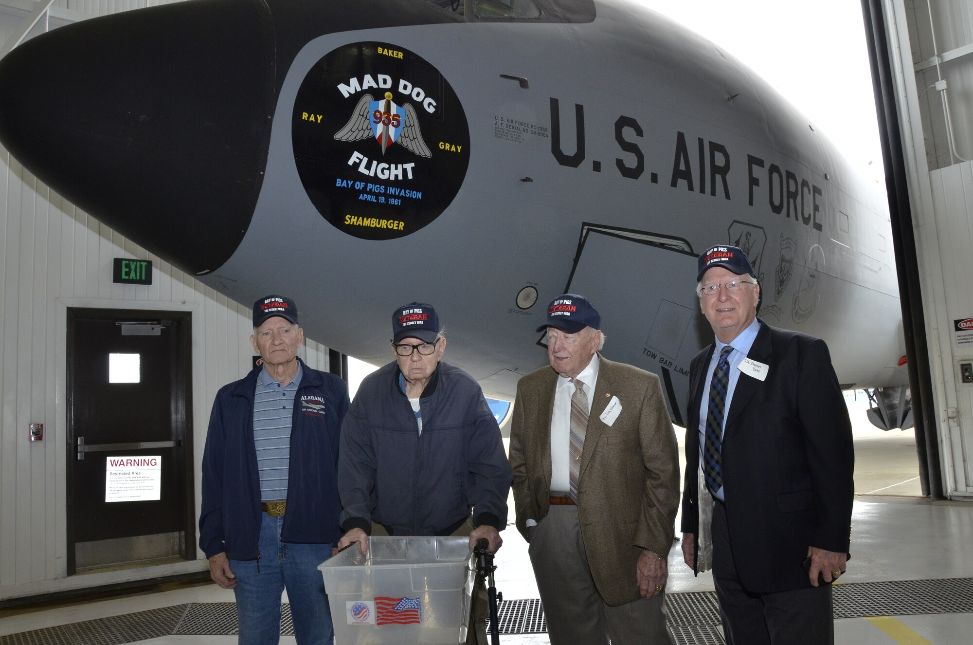 Retired members from the 117th Air Refueling Wing who participated in the Bay of Pigs invasion are honored during a nose art dedication for the Alabama Air National Guardsmen who were shot down and killed during the invasion. They are a few of the last surviving participants of the secret operation that cost the lives of Thomas Pete Ray, Riley Shamburger, Leo Baker and Wade Gray. (U.S. Air National Guard photo by Master Sgt. Ken Johnson/Released)