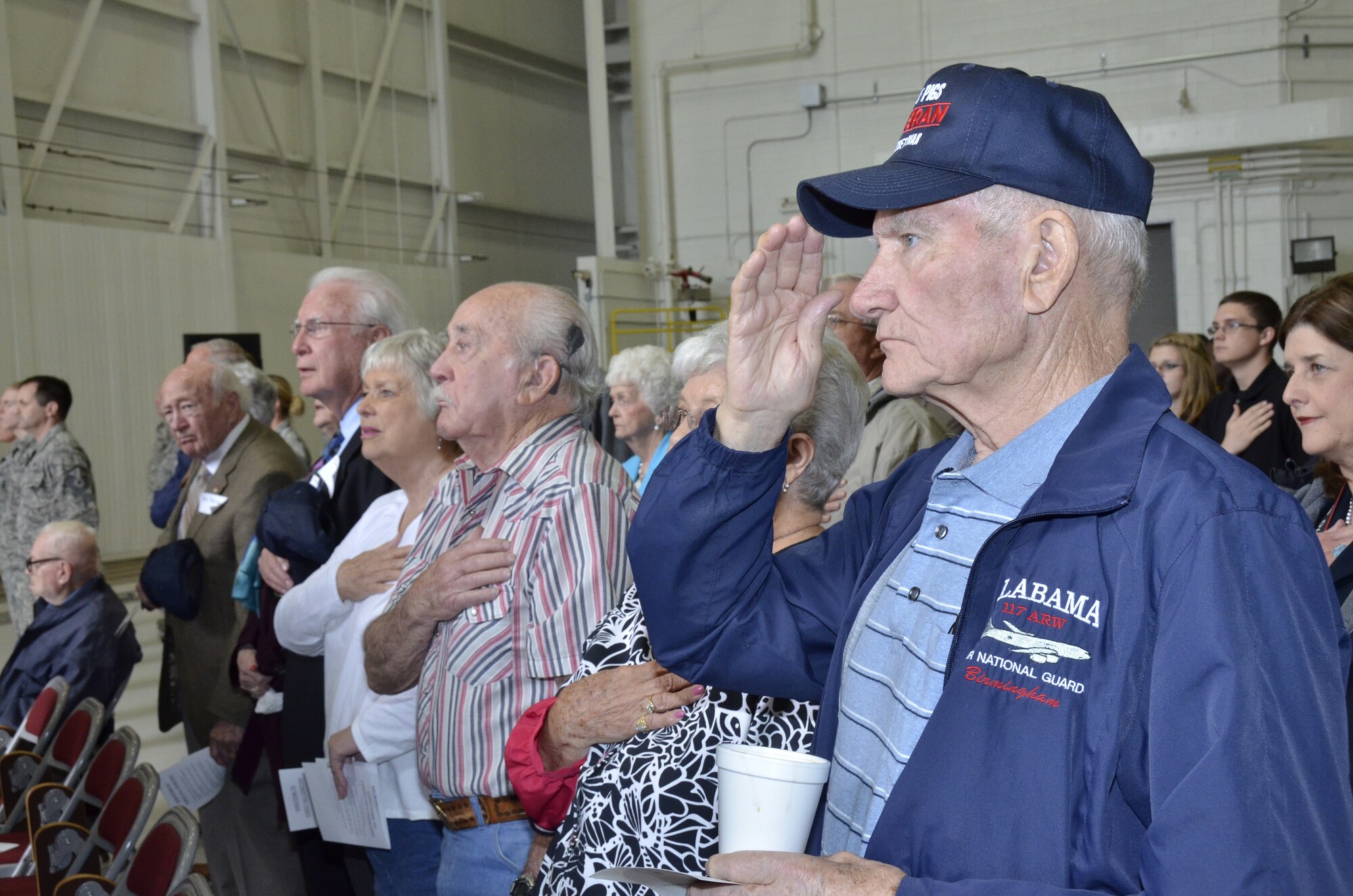 Retired members from the 117th Air Refueling Wing who participated in the Bay of Pigs invasion are honored during a nose art dedication for the Alabama Air National Guardsmen who were shot down and killed during the invasion. They are a few of the last surviving participants of the secret operation that cost the lives of Thomas Pete Ray, Riley Shamburger, Leo Baker and Wade Gray. (U.S. Air National Guard photo by Master Sgt. Ken Johnson/Released)