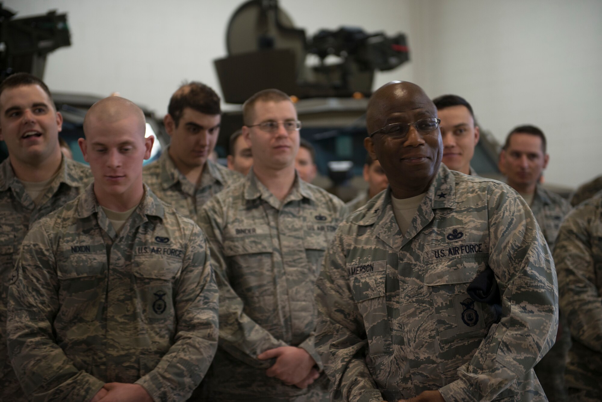 Brig. Gen. Allen J. Jamerson, director of security forces, deputy chief of staff for logistics, installations and mission support, Headquarters U.S. Air Force, speaks with Airmen and views equipment in the vehicle bay at Minot Air Force Base, N.D., April 21, 2014. Jamerson visited Airmen in the 91st Security Forces Group and 5th Security Forces Squadron to boost morale and discuss ideas to improve their career field. (U.S. Air Force photo/Airman 1st Class Sahara L. Fales)