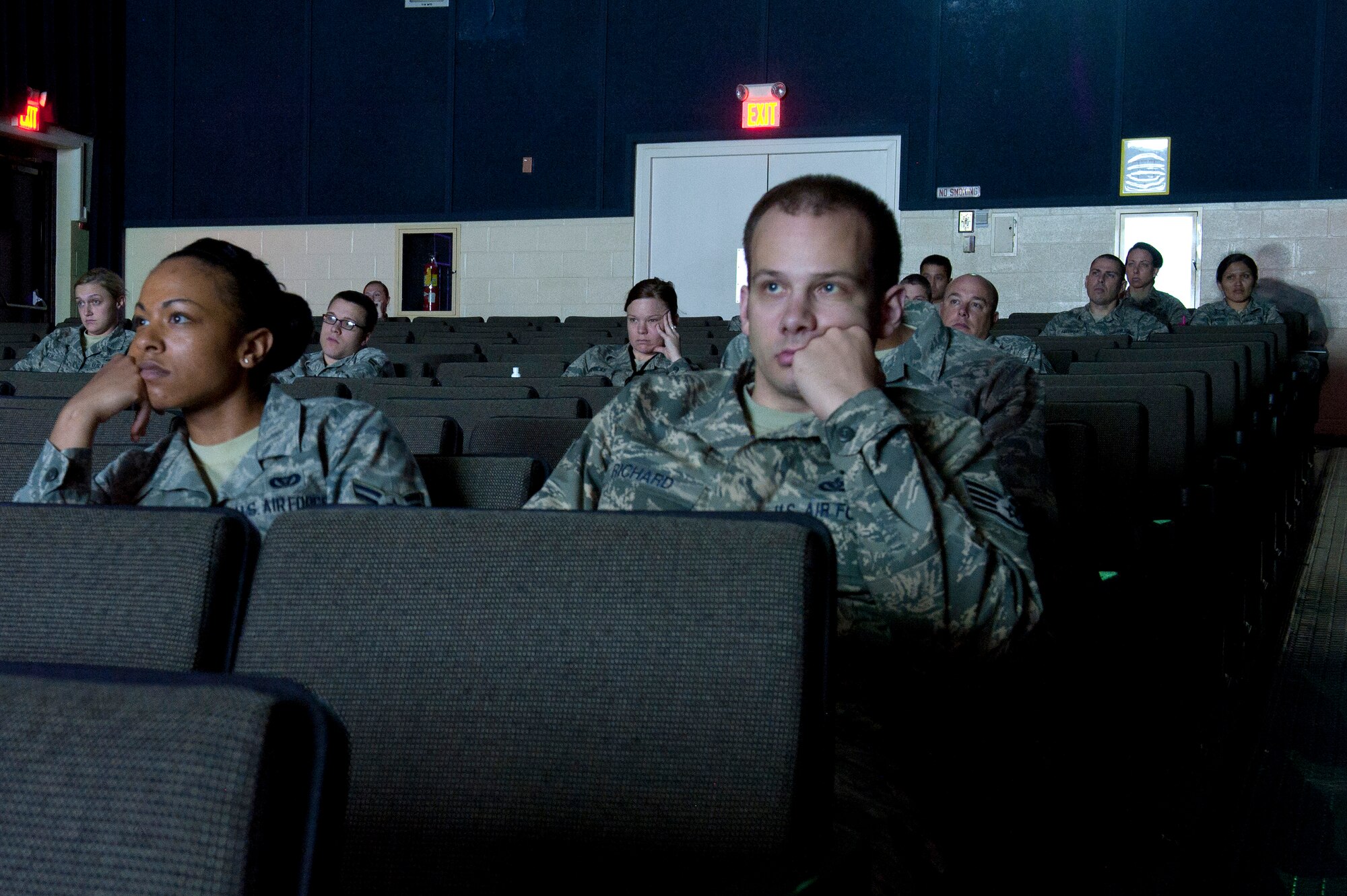 Members of Team Seymour watch a free screening of “The Invisible War,” an investigative documentary about sexual assault within the military, at Seymour Johnson Air Force Base, N.C. This was one of several events organized by the Sexual 
Assault Response Coordinator during Sexual Assault Awareness Month. (U.S. Air Force photo/Airman 1st Class Aaron J. Jenne)
