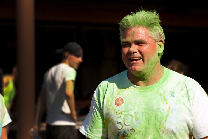 U.S. Navy Capt. Timothy Sparks, Joint Base Charleston deputy commander, participates in the annual color run 5k fun run on Joint Base Charleston, April 26, 2014. The run was held as a Sexual Assualt Awareness event and fundraiser for anyone with base access who wanted to participate and help raise awareness. (U.S. Air Force photo/Staff Sgt. Renae Pittman)