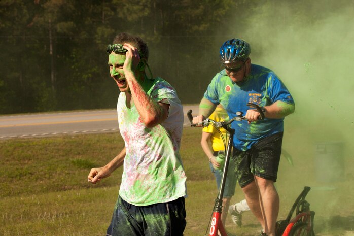Members of Joint Base Charleston participate in the annual color run 5k fun run on April 26, 2014. The run was held as a Sexual Assualt Awareness event and fundraiser for anyone with base access who wanted to participate and help raise awareness. (U.S. Air Force photo/Staff Sgt. Renae Pittman)