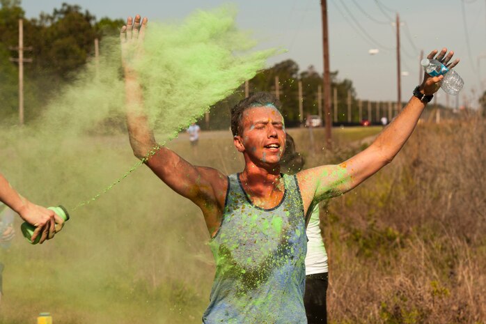Members of Joint Base Charleston participate in the annual color run 5k fun run on April 26, 2014. The run was held as a Sexual Assualt Awareness event and fundraiser for anyone with base access who wanted to participate and help raise awareness. (U.S. Air Force photo/Staff Sgt. Renae Pittman)