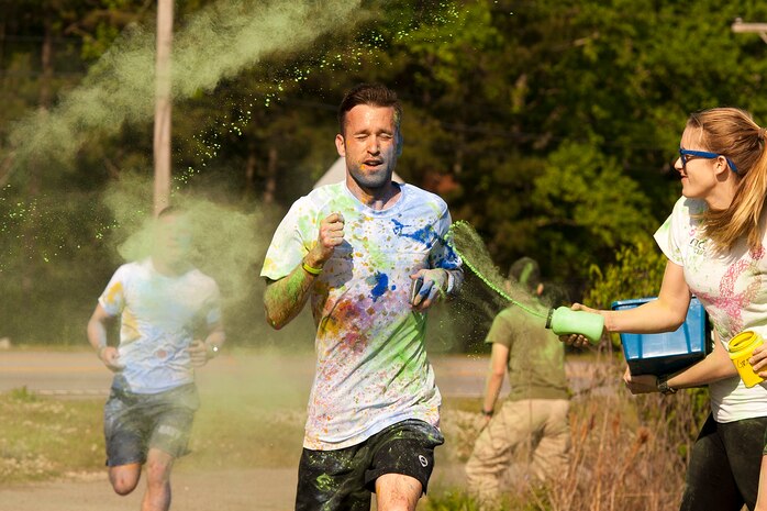 Members of Joint Base Charleston participate in the annual color run 5k fun run on April 26, 2014. The run was held as a Sexual Assualt Awareness event and fundraiser for anyone with base access who wanted to participate and help raise awareness. (U.S. Air Force photo/Staff Sgt. Renae Pittman)