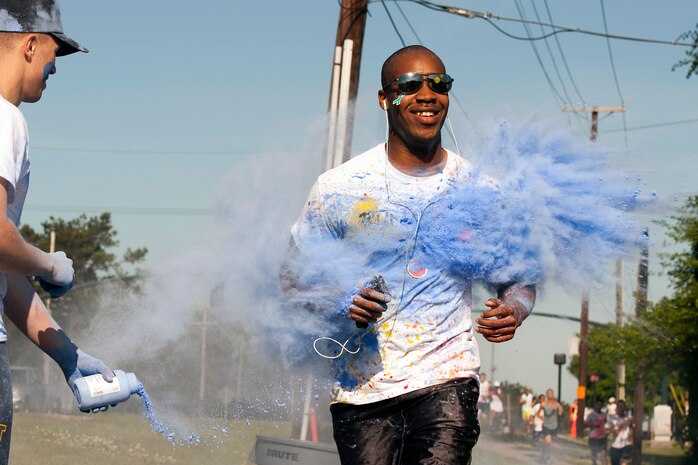 Members of Joint Base Charleston participate in the annual color run 5k fun run on April 26, 2014. The run was held as a Sexual Assualt Awareness event and fundraiser for anyone with base access who wanted to participate and help raise awareness. (U.S. Air Force photo/Staff Sgt. Renae Pittman)