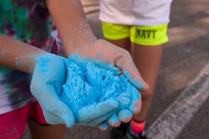 Members of Joint Base Charleston participate in the annual color run 5k fun run on April 26, 2014. There were a total of five color stations the runners passed through, with volunteers at each station covering them with powder and liquid colors. (U.S. Air Force photo/Staff Sgt. Renae Pittman)