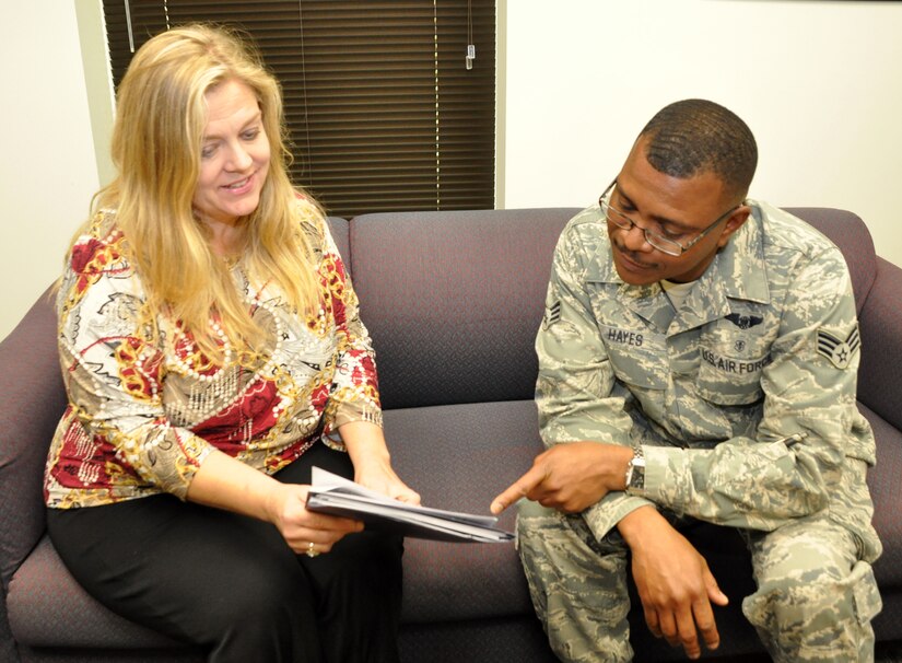 Julie Russell, psychological health director, chats with SrA Colin Hayes, medical technition at the 459th Aeromedical Evacuation Squadron, on the importance of psychological health, April 28, 2014. The Psychological Health Program is a new program at the wing and is geared toward helping Airmen and their families maximize psychological health, resilience, and wellbeing so they can overcome the challenges of life both in and out of the military. (U.S. Air Force photo/ Staff Sgt. Katie Spencer)