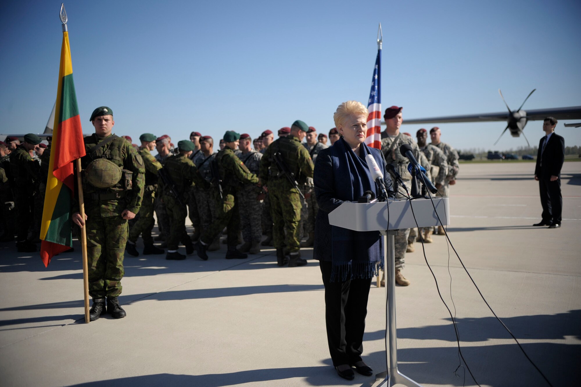 Dalia Grybauskaitė, Lithuanian President, speaks with members of the media after greeting 150 paratroopers from the 173rd Infantry Brigade Combat Team (Airborne) at Siauliai air base, Lithuania, April 26, 2014. The paratroopers arrived in Lithuania to train with soldiers from the Lithuanian Army and to further demonstrate U.S. commitment to NATO at the request of the host nations in the region. (U.S. Air Force photo/Staff Sgt. Sara Keller)