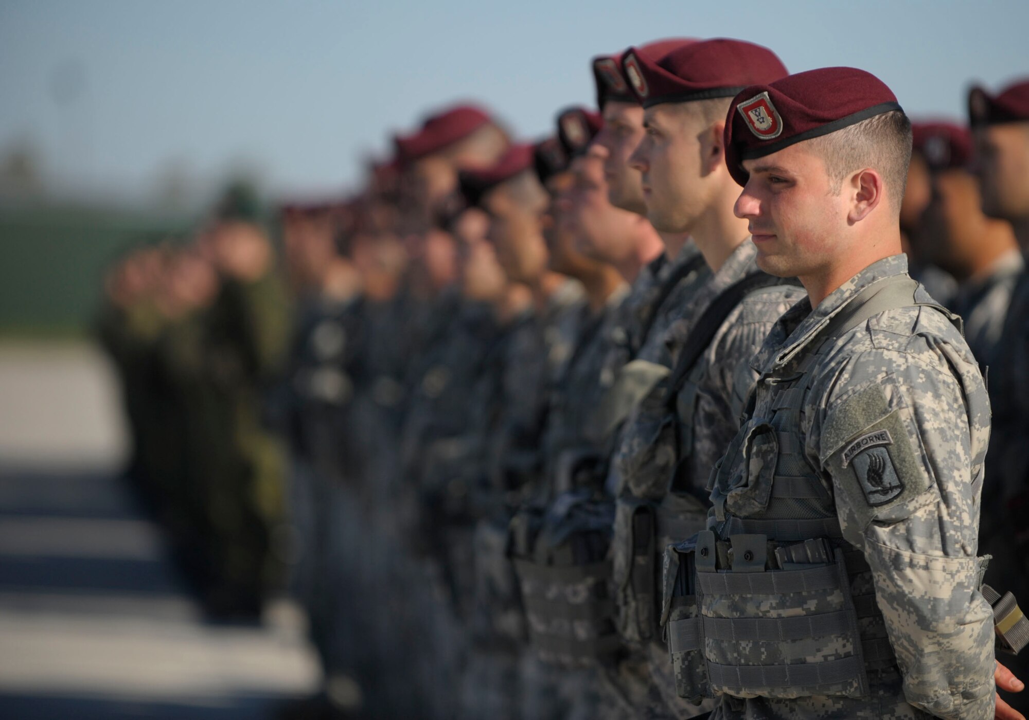 Paratroopers from the 173rd Infantry Brigade Combat Team (Airborne) stand in formation alongside Lithuanian soldiers at Siauliai air base, Lithuania, April 26, 2014. Airmen from the 37th Airlift Squadron transported 150 paratroopers from Aviano Air Base, Italy to Lithuania at the request of the host nations in the region and to further demonstrate U.S. commitment to NATO. (U.S. Air Force photo/Staff Sgt. Sara Keller)