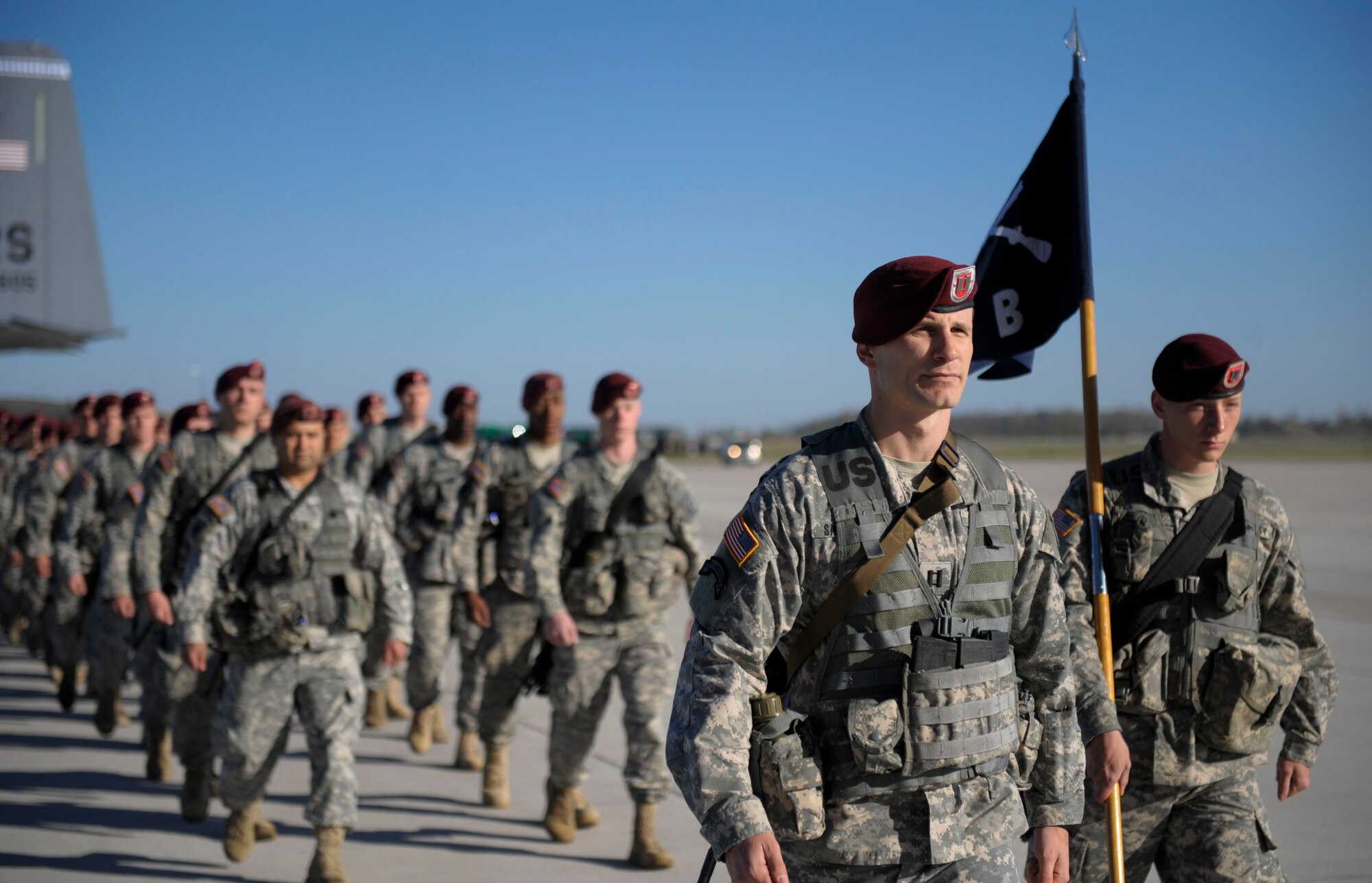 Paratroopers from the 173rd Infantry Brigade Combat Team (Airborne) march as they exit a C-130J Super Hercules at Siauliai air base, Lithuania, April 26, 2014. Airmen from the 37th Airlift Squadron transported 150 paratroopers from Aviano Air Base, Italy to Lithuania at the request of the host nations in the region and to further demonstrate U.S. commitment to NATO. (U.S. Air Force photo/Staff Sgt. Sara Keller)