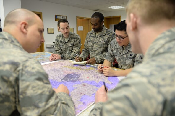 U.S. Air Force Airmen from the 52nd Intelligence Flight, review a map of Germany during training at Spangdahlem Air Base, Germany. Members have to get specialized training on the F-16 Fighting Falcon before being mission capable for the 480th Fighter Squadron. Slots were cut last year and without training, the Airmen couldn’t deploy or support the mission. To avoid mission failure, the intelligence flight here was the first and only to teach the F-16 Intelligence Formal Training Unit at home base. (U.S. Air Force photo by Senior Airman Siekert/Released)