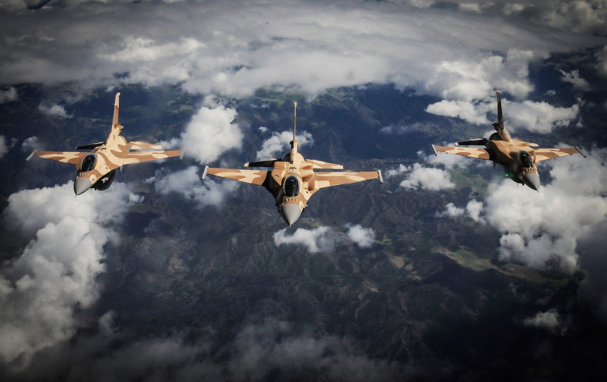 Three F-16s from the Royal Moroccan air force link up with a KC-135 Stratotanker from the 191st Air Refueling Squadron based out of Salt Lake City, Utah to refuel during the 2014 Aeroexpo Marrakech Trade Show in Morocco April 21. The U.S. Air Force sent a C-130J Super Hercules from the 37th Airlift Squadron based out of Ramstein Air Base, Germany and a KC-135 Stratotanker to showcase air assets that are critical to the success of current and future multinational military operations in Africa. (U.S. Army photo/ Sgt. Nicolas A. Cloward)
