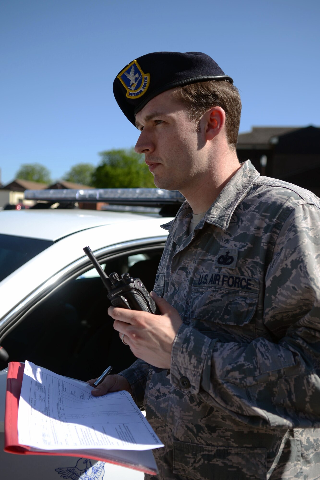 U.S. Air Force Staff Sgt. Michael Peter, 100th Security Forces Squadron evaluator from Sacramento, Calif., evaluates an exercise April 15, 2014, on RAF Mildenhall, England. Peter earned the Square D Spotlight for exhibiting the Air Force Core Value of Excellence in All We Do. (U.S. Air Force photo by Airman 1st Class Kyla Gifford/Released)