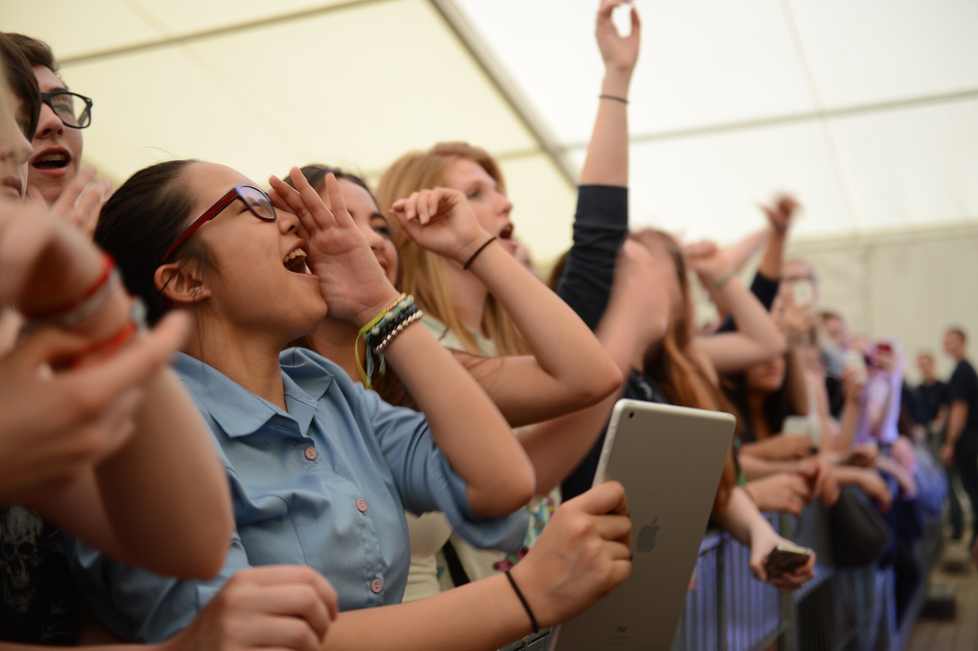A fan screams in excitement as 3OH!3 performs during a free concert hosted by Armed Forces Entertainment April 25th, 2014, at Ramstein Air Base Germany. 3OH!3 is an American electronic musical duo from Boulder, Colorado. The duet performed for an hour before signing autographs and taking photos with their fans after the show. (U.S. Air Force Photo/Airman 1st Class Michael Stuart) 