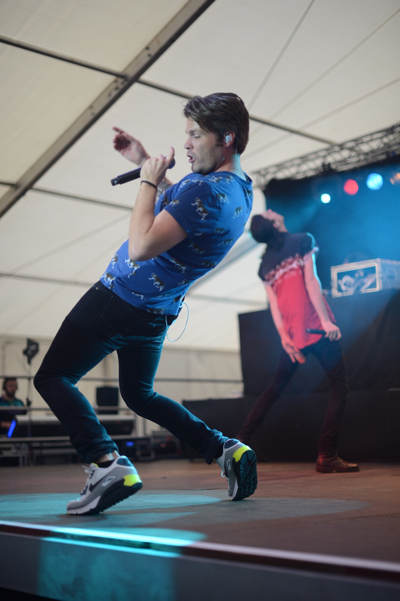 Sean Foreman, (left) and Nathaniel Motte, American musicians, dance on stage during a free concert hosted by Armed Forces Entertainment April 25th, 2014, at Ramstein Air Base Germany. Foreman and Motte are a part of 3OH!3, an American electronic musical duo from Boulder, Colorado. The duo spent time at the USO Warrior Center interacting with Wounded Warriors before they performed for Airmen and their families. (U.S. Air Force Photo/Airman 1st Class Michael Stuart)