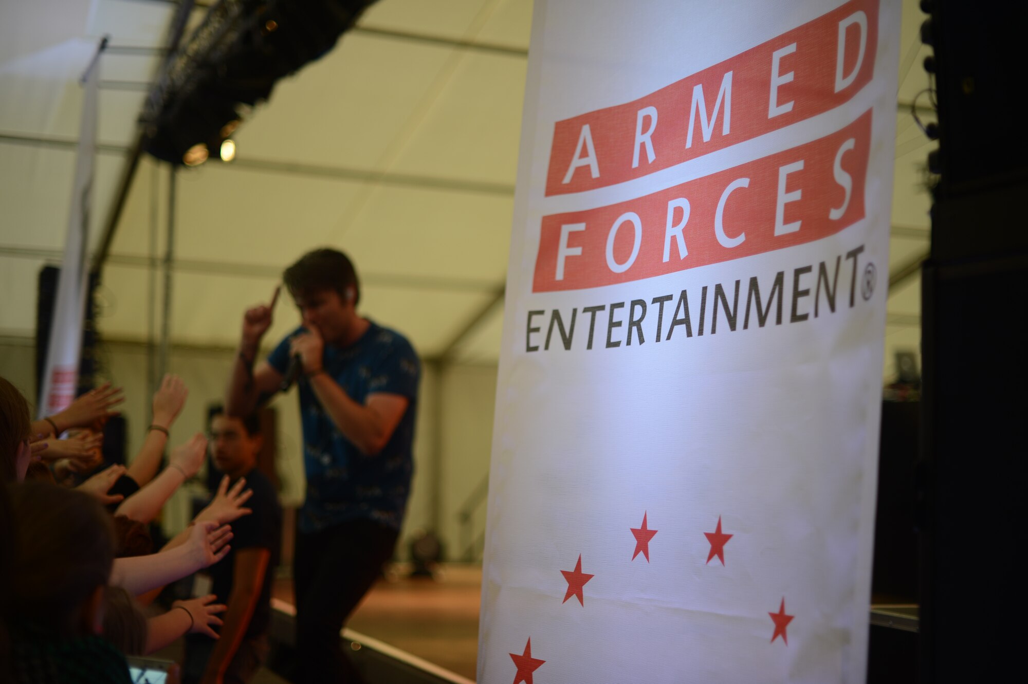Sean Foreman, American musician, performs on stage during a free concert hosted by Armed Forces Entertainment April 25th, 2014, at Ramstein Air Base Germany. Foreman is a part of 3OH!3, an American electronic musical duo from Boulder, Colorado. The duo spent time at the USO Warrior Center interacting with Wounded Warriors before they performed for Airmen and their families. (U.S. Air Force Photo/Airman 1st Class Michael Stuart)