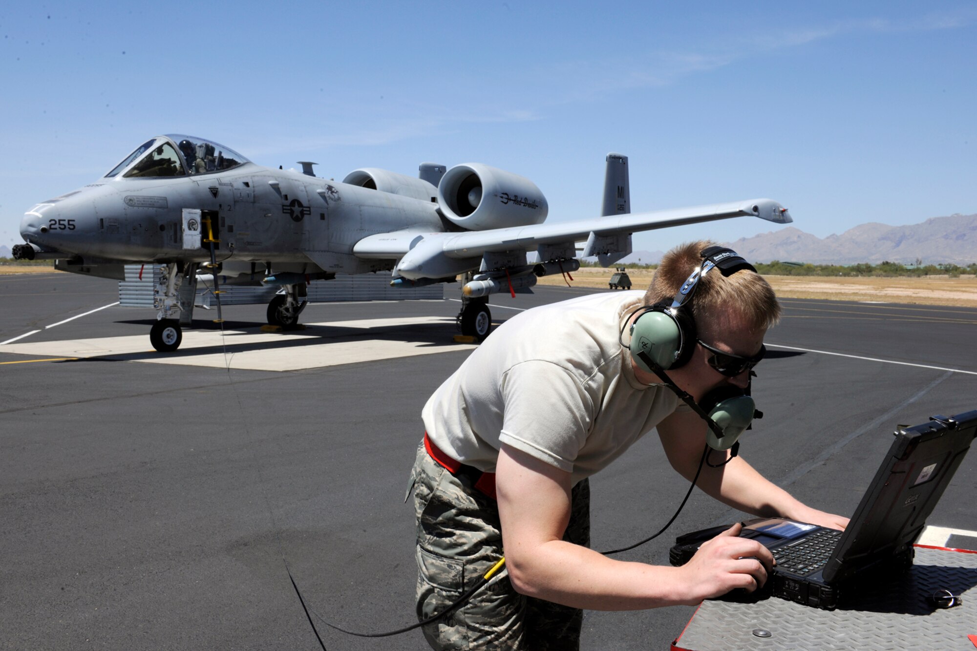 140428-Z-EZ686-010—Senior Airman Brett Baver, a crew chief of the 127th Aircraft Maintenance Squadron, verifies the pre-flight manual prior to marshaling the A-10 Thunderbolt II aircraft from Selfridge Air National Guard Base Mich., to the flight line, during the 2014 operation Snowbird/Angel Thunder training mission at Davis-Monthan Air Force Base, Tucson, Ariz., April 26, 2014.  Baver marshaled one of the first few A-10 Thunderbolt II aircraft to the flight line that commenced the operation Angel Thunder training mission.  (U.S. Air National Guard photo by MSgt. David Kujawa/Released)