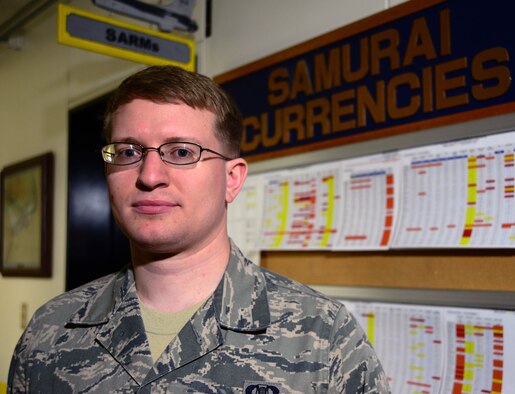 Senior Airman Christopher Andersen, 14th Fighter Squadron aviation resource manager, stands in front of pilots’ flight currencies at Misawa Air Base, Japan, April 23, 2014. Andersen has served as an aviation resource manager here for more than two years and tracks records of all 14 FS pilots to ensure they are full qualified to execute the 35th Fighter Wing mission of the Suppression of Enemy Air Defenses. (U.S. Air Force photo/Senior Airman Derek VanHorn)