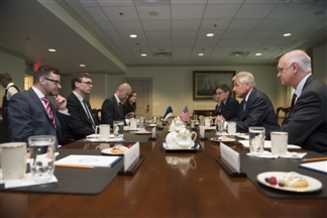 U.S. Defense Secretary Chuck Hagel, second from right, meets with Estonian Defense Minister Sven Mikser, second from left, at the Pentagon. April 29, 2014. The two defense leaders met to discuss issues of mutual importance.