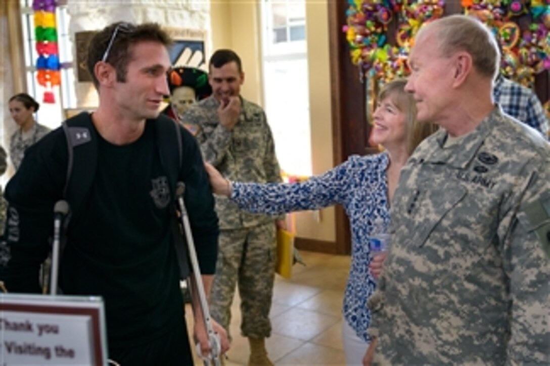 Army Gen. Martin E. Dempsey, right, chairman of the Joint Chiefs of Staff, and his wife, Deanie, talk with soldiers on Fort Sam Houston, Texas, April 25, 2014. 