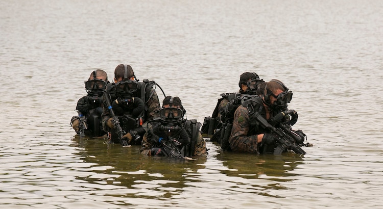 Marines dive toward objective during beach reconnaissance training ...