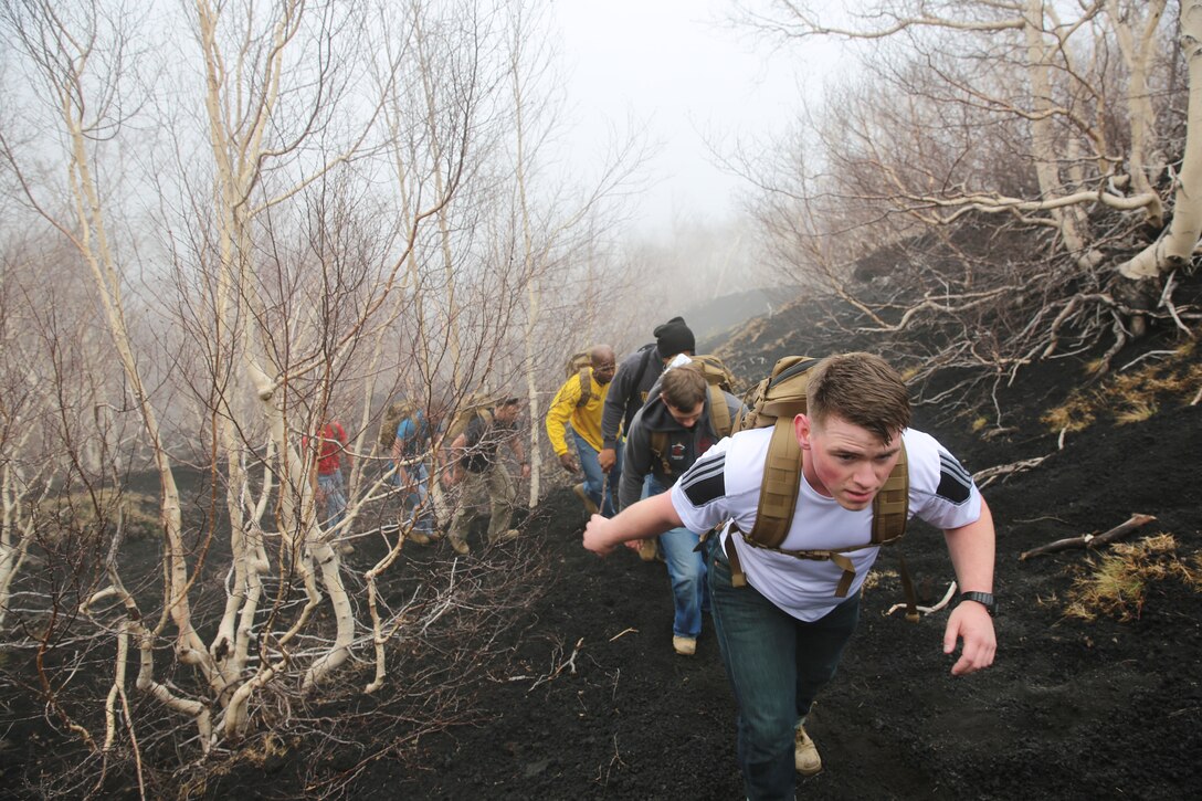Marines and sailors with Special-Purpose Marine Air-Ground Task Force Africa 14 hike up a trail on Mt. Etna, Italy, April 26, 2014. The service members hiked up the volcano in observance of Earth Day.
