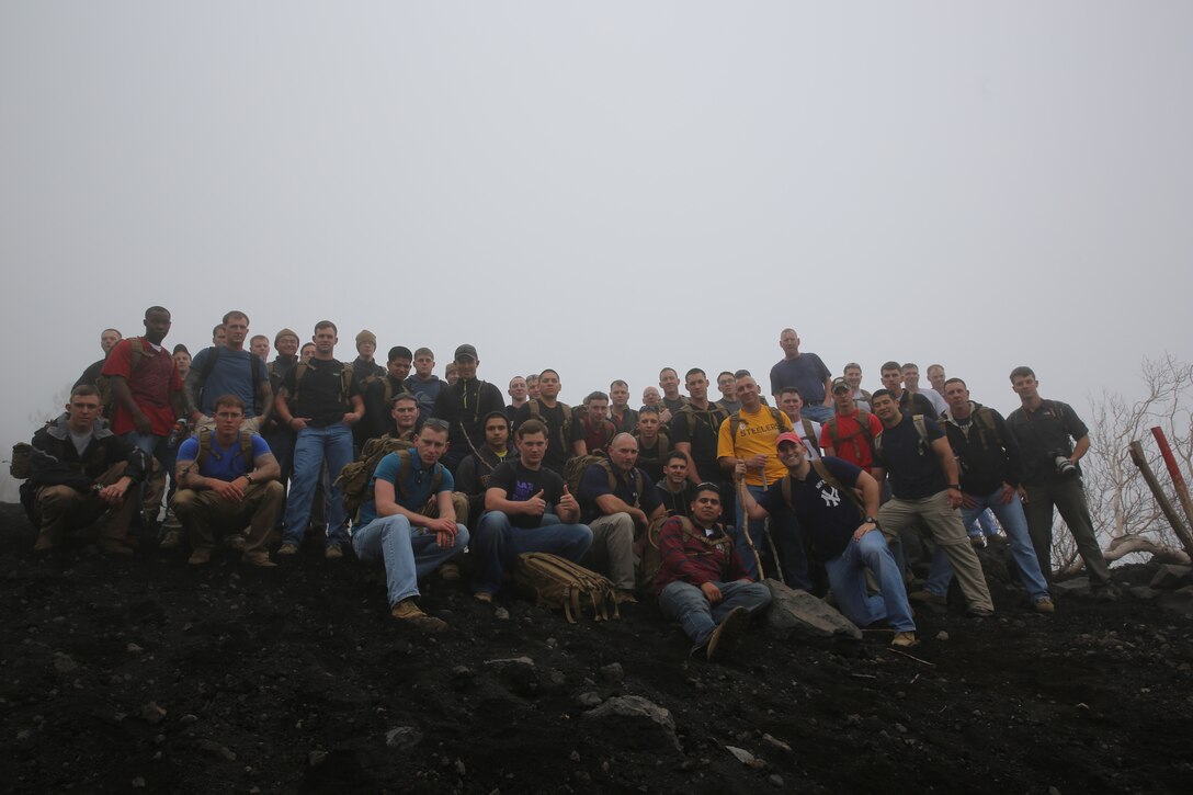 Marines and sailors with Special-Purpose Marine Air-Ground Task Force Africa 14 pose for a photo on a trail on Mt. Etna, Italy, April 26, 2014. The service members hiked up the volcano in observance of Earth Day.