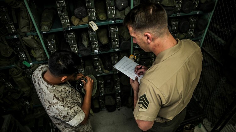 Sergeant Kristopher Golden, right, radio chief, conducts an inventory with Cpl. Amos Nunglian, field radio operator, both with the 15th Marine Expeditionary Unit aboard Camp Pendleton, Calif., April 25, 2014. Golden, 27, is from Lacey, Wash.