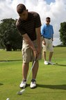 Cpl. Grant A. Warren, native of Columbus, Ohio, and amphibious assault vehicle crewman with 2nd Assault Amphibian Battalion, 2nd Marine Division, Marine Corps Base Camp Lejeune, N.C., putts his ball while playing in a golf scramble at the Fort Lauderdale Country Club in Plantation, Fla., April 29. Marines and Sailors from the USS New York (LPD 21) participated in the golf scramble as part of a military appreciation event during Fleet Week Port Everglades 2014. Approximately 120 Marines from 2nd  AAV Bn., 2nd Battalion, 6th Marine Regiment, 2nd Marine Division, Marine Corps Base Camp Lejeune, N.C., and Marine Light Attack Helicopter Squadron (HMLA) 269, Marine Corps Air Station New River, N.C., are participating in the 24th Annual Fleet Week in Port Everglades; South Florida’s annual celebration of maritime forces. (U.S. Marine Corps photo by Sgt. Alicia R. Leaders/Released)