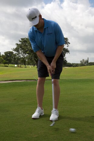Cpl. Joseph A. Pervis, native of Atlanta, Ga., and training noncommissioned officer with 2nd Assault Amphibian Battalion, 2nd Marine Division, Marine Corps Base Camp Lejeune, N.C., putts his ball while playing in a golf scramble at the Fort Lauderdale Country Club in Plantation, Fla., April 29. Marines and Sailors from the USS New York (LPD 21) participated in the golf scramble as part of a military appreciation event during Fleet Week Port Everglades 2014. Approximately 120 Marines from 2nd  AAV Bn., 2nd Battalion, 6th Marine Regiment, 2nd Marine Division, Marine Corps Base Camp Lejeune, N.C., and Marine Light Attack Helicopter Squadron (HMLA) 269, Marine Corps Air Station New River, N.C., are participating in the 24th Annual Fleet Week in Port Everglades; South Florida’s annual celebration of maritime forces. (U.S. Marine Corps photo by Sgt. Alicia R. Leaders/Released)
