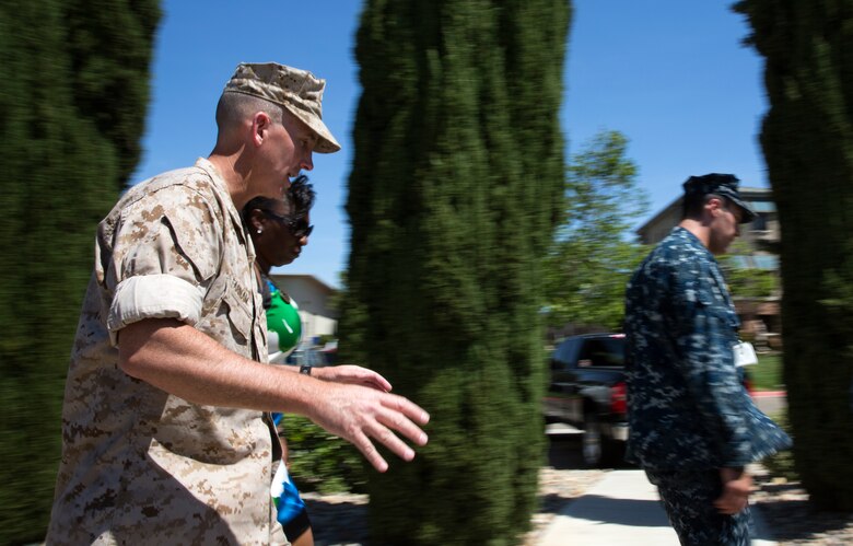 Col. John Farnam, Marine Corps Air Station Miramar, Calif., commanding officer, takes part in the fifth annual Sexual Assault Awareness Month Walk aboard the air station, April 29. Farnam believes getting people together and educating them will heighten awareness and show the community’s unity against sexual assault.
