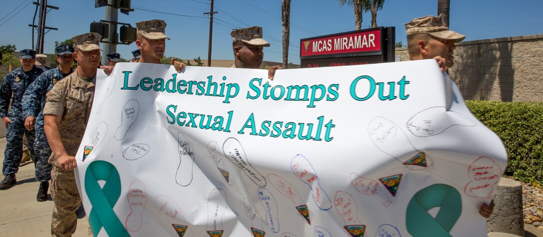 Marines, sailors, families and civilian working aboard Marine Corps Air Station Miramar, Calif., walk along the streets to raise awareness about sexual assault during the fifth annual Sexual Assault Awareness Month Walk aboard the air station, April 29. Participants of different ranks, jobs and creeds gathered to show support in stopping sexual assault.