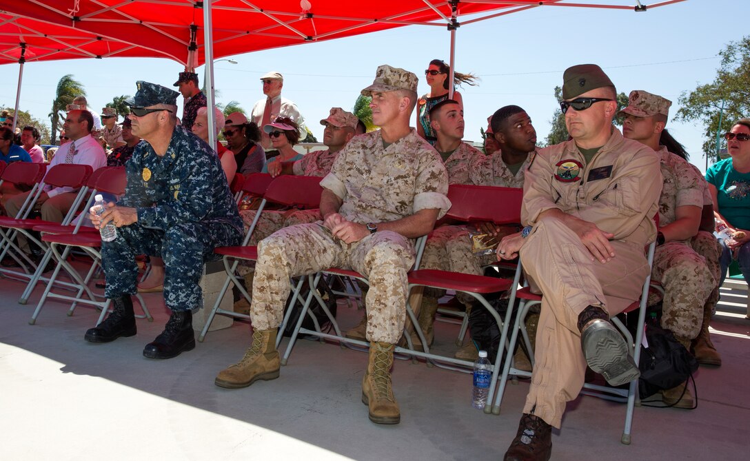 Navy Command Master Chief Roy Re, left, Naval Consolidated Brig command master chief, Col. John Farnam, center, Marine Corps Air Station Miramar, Calif., commanding officer, and Lt. Col. Daniel Levasseur, right, Headquarters and Headquarters Squadron commanding officer, listen to the guest speaker’s testimonial after the fifth annual Sexual Assault Awareness Month Walk aboard MCAS Miramar, April 29. Senior leadership participated in the walk to show their support for both victims and raising awareness about sexual assault.  