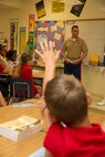 Tyler M. Nilson, fourth grader of Harbordale Elementary School in Fort Lauderdale, Fla., raises his hand to ask a question to Cpl. Joel A. Slaymaker, native of Lancaster, Penn., and amphibious assault crewman with 2nd Assault Amphibian Battalion, 2nd Marine Division, Marine Corps Base Camp Lejeune, N.C., during a school visit to Harbordale Elementary School in Fort Lauderdale, Fla., April 30, as part of a community relations event of Fleet Week Port Everglades 2014. Three Marines from 2nd AAV Bn., and 2nd Battalion, 6th Marine Regiment, 2nd Marine Division, as well as Sailors from the USS New York (LPD 21) and Carrier Strike Group 12 spoke to more than 450 Harbordale Elementary students about their experiences in the military and on ship. (U.S. Marine Corps photo by Sgt. Alicia R. Leaders/Released)