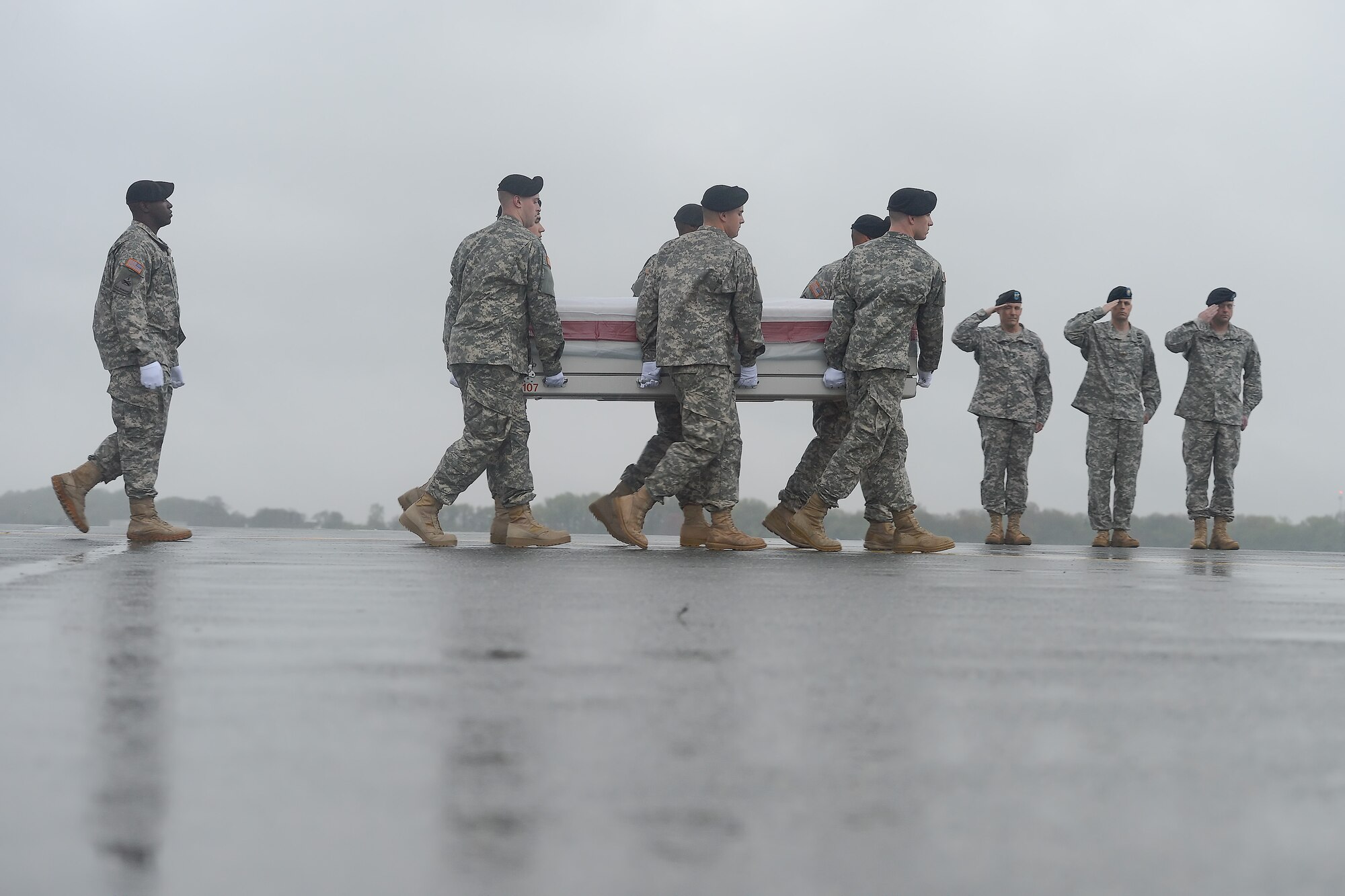 A U.S. Army carry team transfers the remains of Pfc. Christian J. Chandler, of Trenton, Texas, during a dignified transfer April 30, 2014 at Dover Air Force Base, Del. Chandler was assigned to Company B, 2nd Battalion, 87th Infantry Regiment, 3rd Brigade Combat Team, 10th Mountain Division (Light), Fort Drum, N.Y. (U.S. Air Force photo/Greg L. Davis)