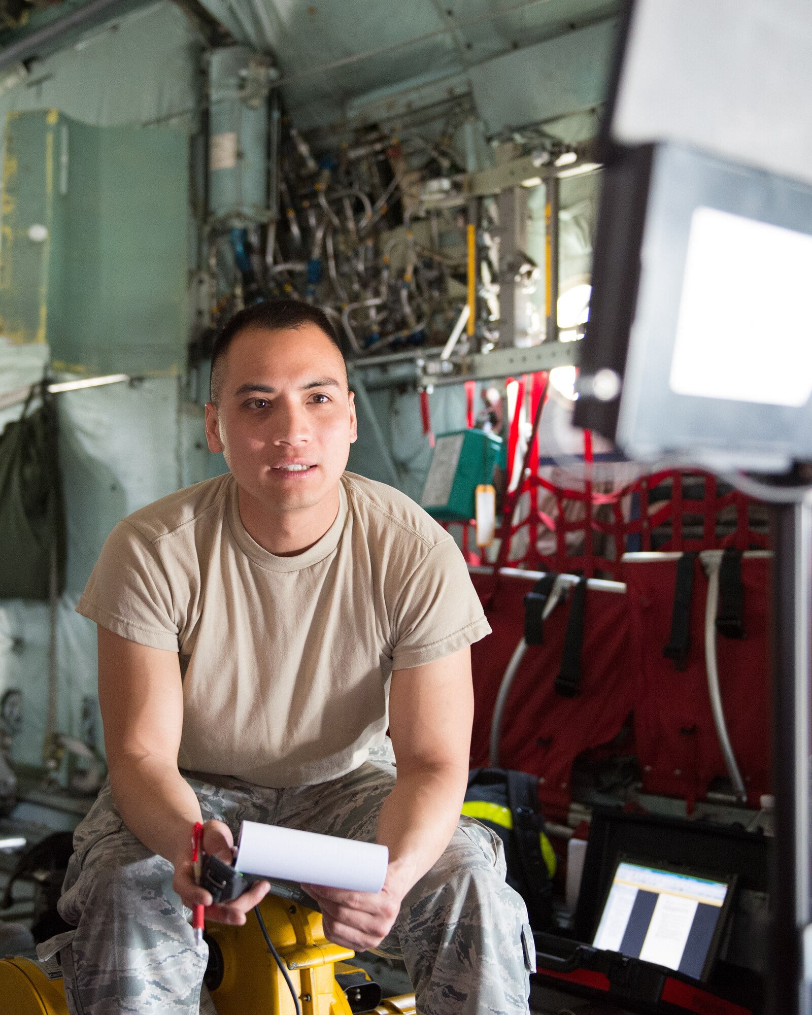Senior Airman Paul Nguyen, 374th Aircraft Maintenance Squadron electrical and environment journeyman, monitors a screen projected from a borescope inside parts of a C-130 Hercules at Yokota Air Base, Japan, April 28, 2014. As the borescope traveled through the aircraft parts, Nguyen took screenshots to be later analyzed.  (U.S. Air Force photo by Osakabe Yasuo/Released)
