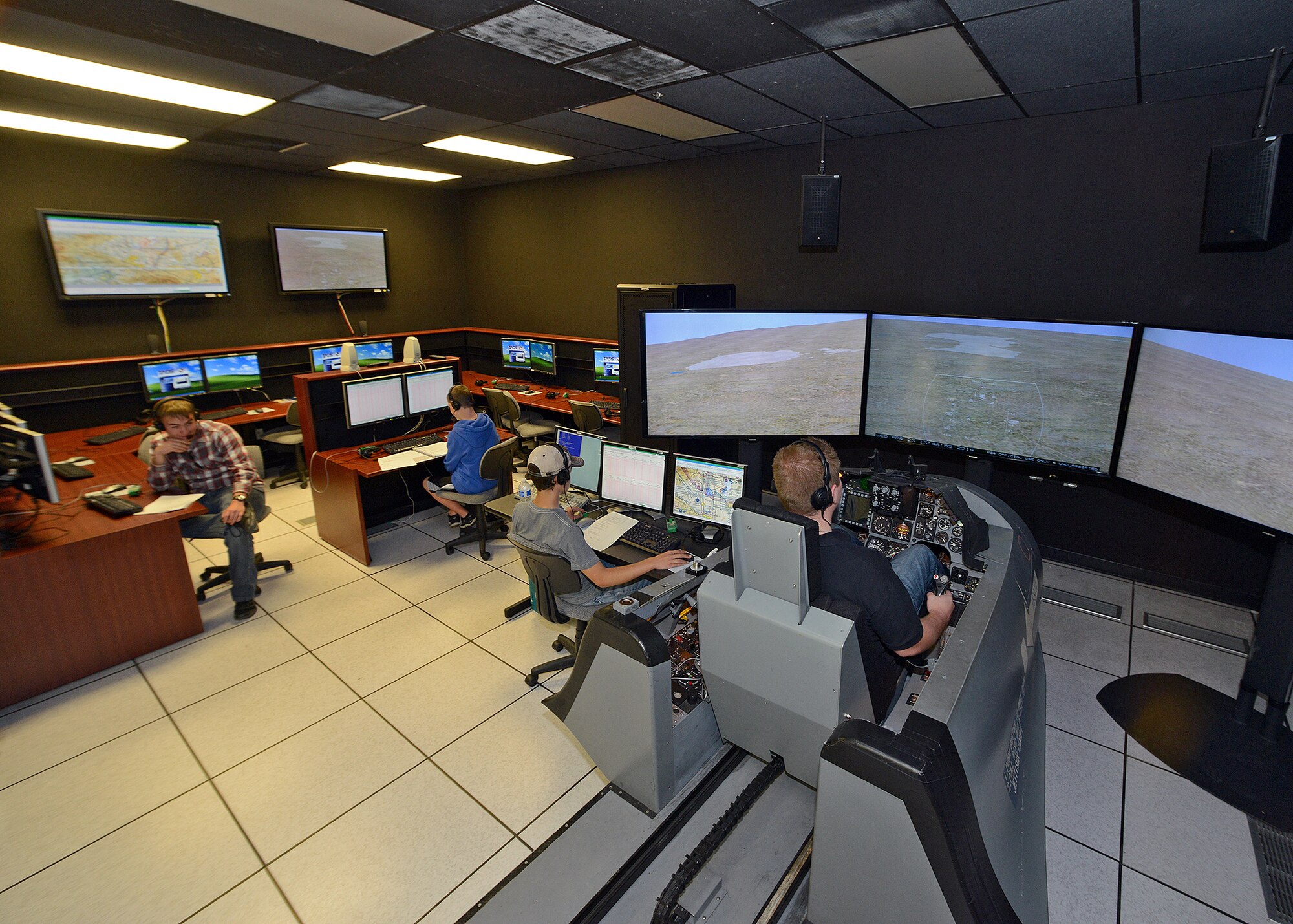Aero Camp students undergo a mission control room training scenario April 24 at the Integration Facility for Avionics System Testing (IFAST) building as part of their Aero Camp curriculum.This year's second annual Aero Camp was held April 21 to 25, and is intended to train students, ages 14 to 19, with the help of certified Aero Club flight instructors in the areas of flight and ground school training. The second camp is scheduled for late July.(U.S. Air Force photo by Jet Fabara)