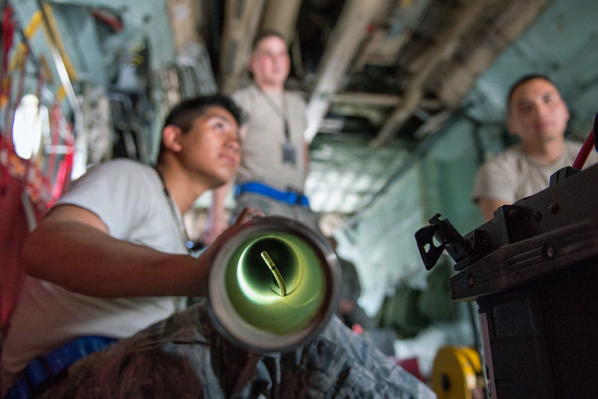 Maintainers from the 374th Aircraft Maintenance Squadron electrical and environmental shop inspect parts of a C-130 Hercules using a borescope at Yokota Air Base, Japan, April 28, 2014. The borescope consists of a miniature video camera on the end of a flexible tube that projects the image on a screen, allowing Airmen to inspect otherwise inaccessible parts of an aircraft. (U.S. Air Force photo by Osakabe Yasuo/Released)