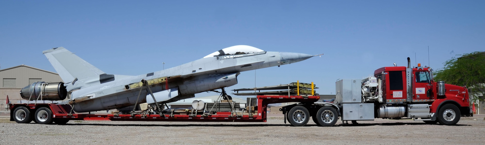 A disassembled F-16 Fighting Falcon sits on the bed of an 18-wheeler at Davis-Monthan Air Force Base, Ariz., April 30, 2014. The aircraft was received from the 309th Aircraft Maintenance and Regeneration Group and disassembled by members of the 149th Fighter Wing during their recent temporary duty assignment to D-M. (U.S. Air Force photo by Airman 1st Class Betty R. Chevalier/Released)