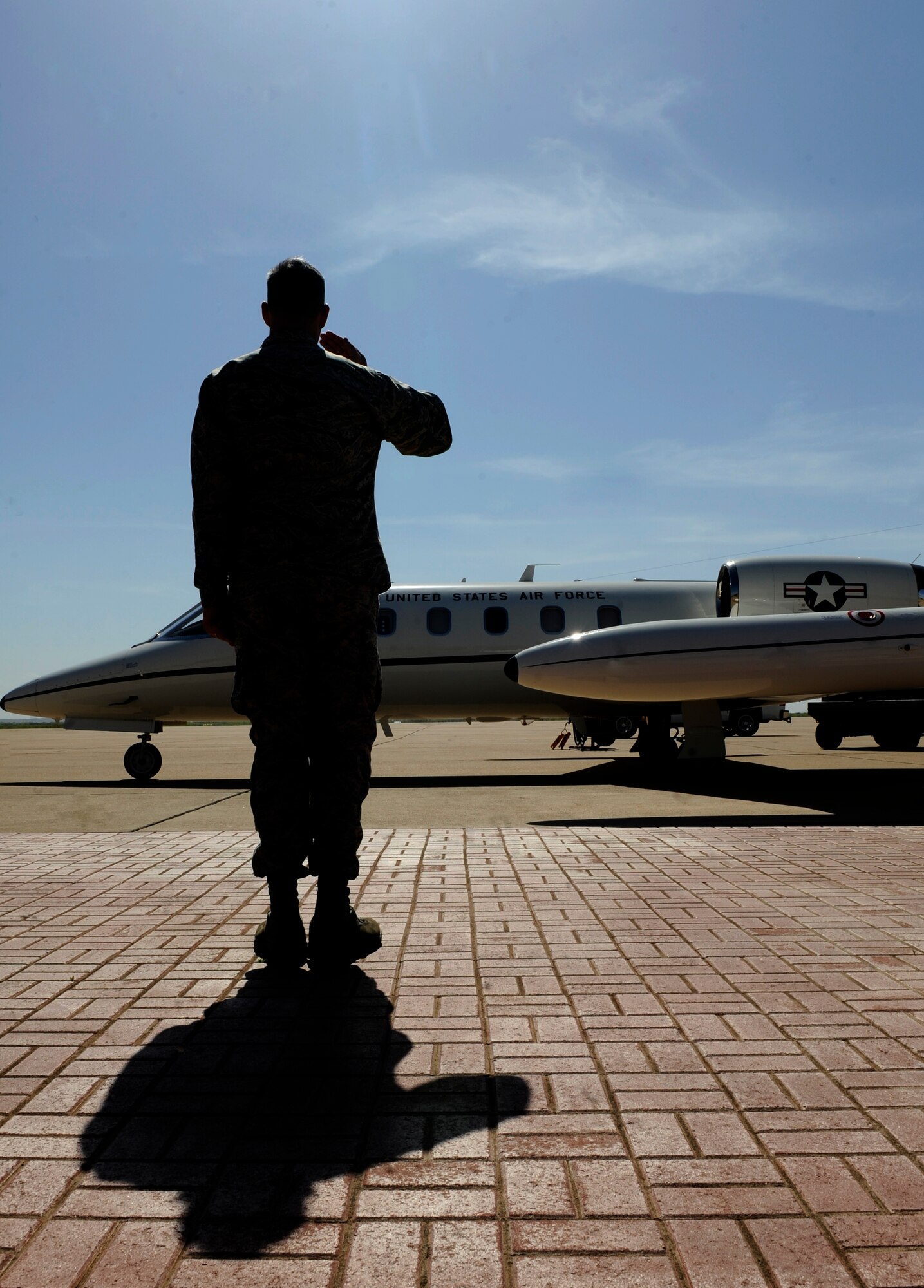 U.S. Air Force Col. Steven Beasley, 7th Bomb Wing vice commander, salutes Lt. Gen. Stephen Wilson, Air Force Global Strike Command commander, as his plane taxis to the flight line April 25, 2014, at Dyess Air Force Base, Texas. Wilson is responsible for organizing, training, equipping and maintaining all U.S. intercontinental ballistic missile and nuclear-capable bomber forces. The command's mission is to develop and provide combat-ready forces for nuclear deterrence and global strike operations to support the president of the United States and combatant commanders. The command comprises more than 23,000 professionals operating at various locations around the globe. (U.S. Air Force photo by Airman 1st Class Alexander Guerrero/Released)