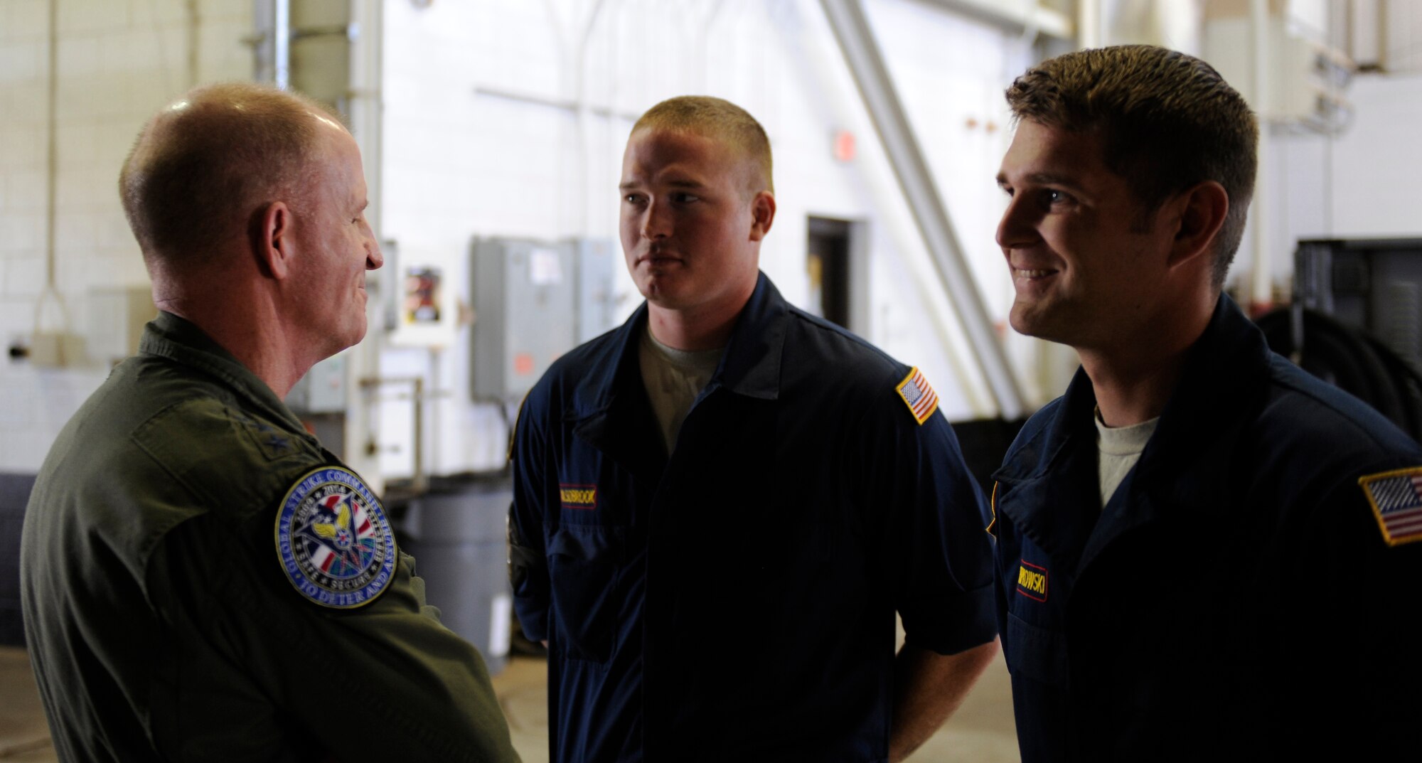U.S. Air Force Lt. Gen. Stephen Wilson, Air Force Global Strike Command commander, left, speaks with Staff Sgt. Tye Alsobrook, center, and Staff Sgt. Jason Ripkowski April 25, 2014, at Dyess Air Force Base, Texas. Wilson took time to speak with the Airmen at the 337th Test and Evaluation Squadron as part of his visit throughout base. (U.S. Air Force photo by Airman 1st Class Alexander Guerrero/Released)