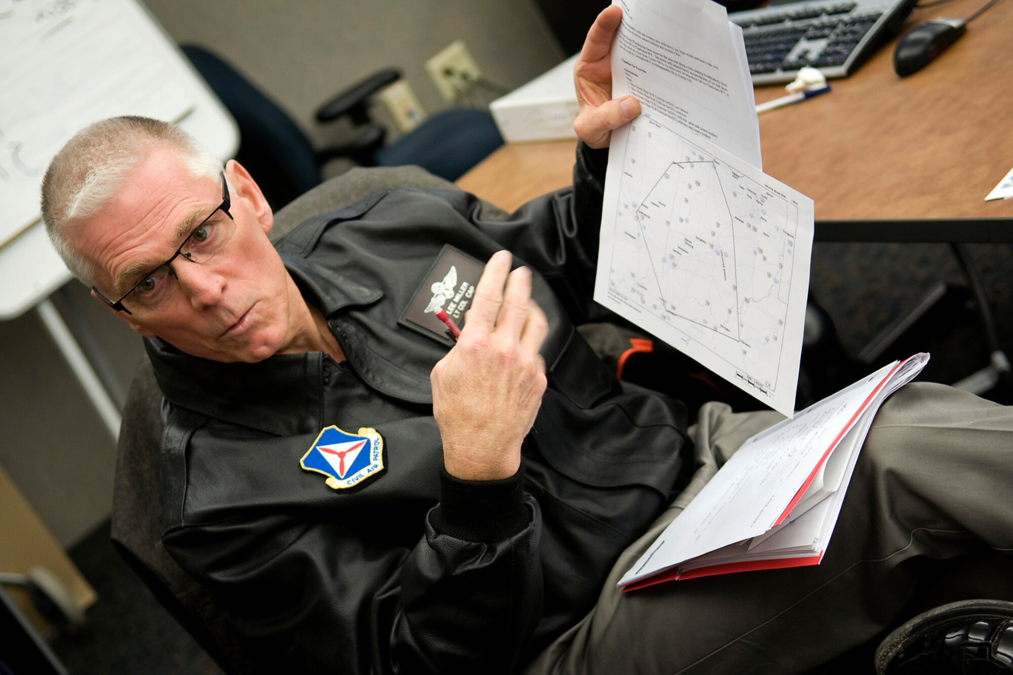 Civil Air Patrol Lt. Col. Lee Miller, the CAP's Michigan Wing emergency services officer, talks about where to set up an incident command center during an incident command system training course at Grissom Air Reserve Base, Ind., April 3, 2014. CAP officers from around the Great Lakes Region, which encompasses Indiana, Illinois, Kentucky, Michigan, Ohio and Wisconsin, came to Grissom to take part in a special training course meant to improve the CAP's  operational capabilities. (U.S. Air Force photo/Tech. Sgt. Mark R. W. Orders-Woempner)
