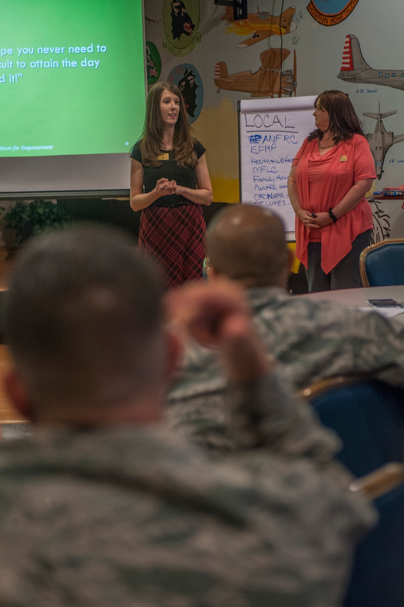 Vicki Farnsworth, assistant program director Specialized Training of Military Parents , gives a brief with Valerie Patterson, STOMP instructor, during training at Mountain Home Air Force Base, Idaho, April 29, 2014. Parents of children with special needs may face unique challenges, such as feelings of isolation, difficulty navigating disjointed services, severe financial worries and inadequate information. STOMP gives parents resources and training on how to advocate for their special needs child. (U.S. Air Force photo by Staff Sgt. Roy Lynch/Released)