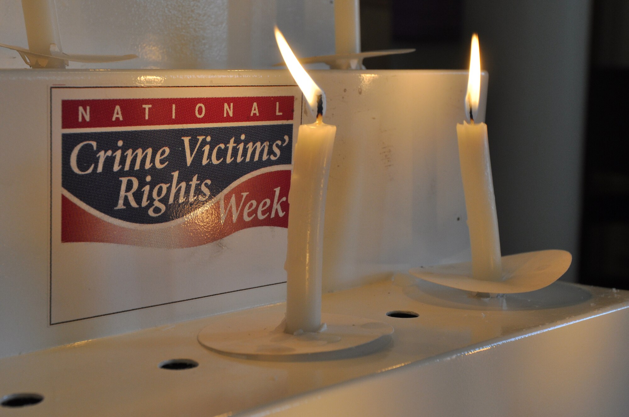 Candles glow to represented those affected during this year's 5th Annual Candlelight Vigil celebrating National Crime Victims' Rights Week, April 6-12 at Naval Air Station Fort Worth Joint Reserve Base, Texas. (U.S. Air Force photo/Master Sgt. Julie Briden-Garcia)