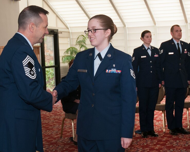 HANSCOM AIR FORCE BASE, Mass. - Chief Master Sgt. Craig A. Poling, Hanscom Air Force Base senior enlisted advisor, congratulates newly promoted Staff Sgt. Paige A. Belin during the monthly enlisted promotion ceremony at the Minuteman Commons, April 30. At the monthly ceremony, generally held on the last duty day of the month, the Hanscom community recognizes enlisted Airmen selected for promotion. (U.S. Air Force photo by Mark Herlihy)