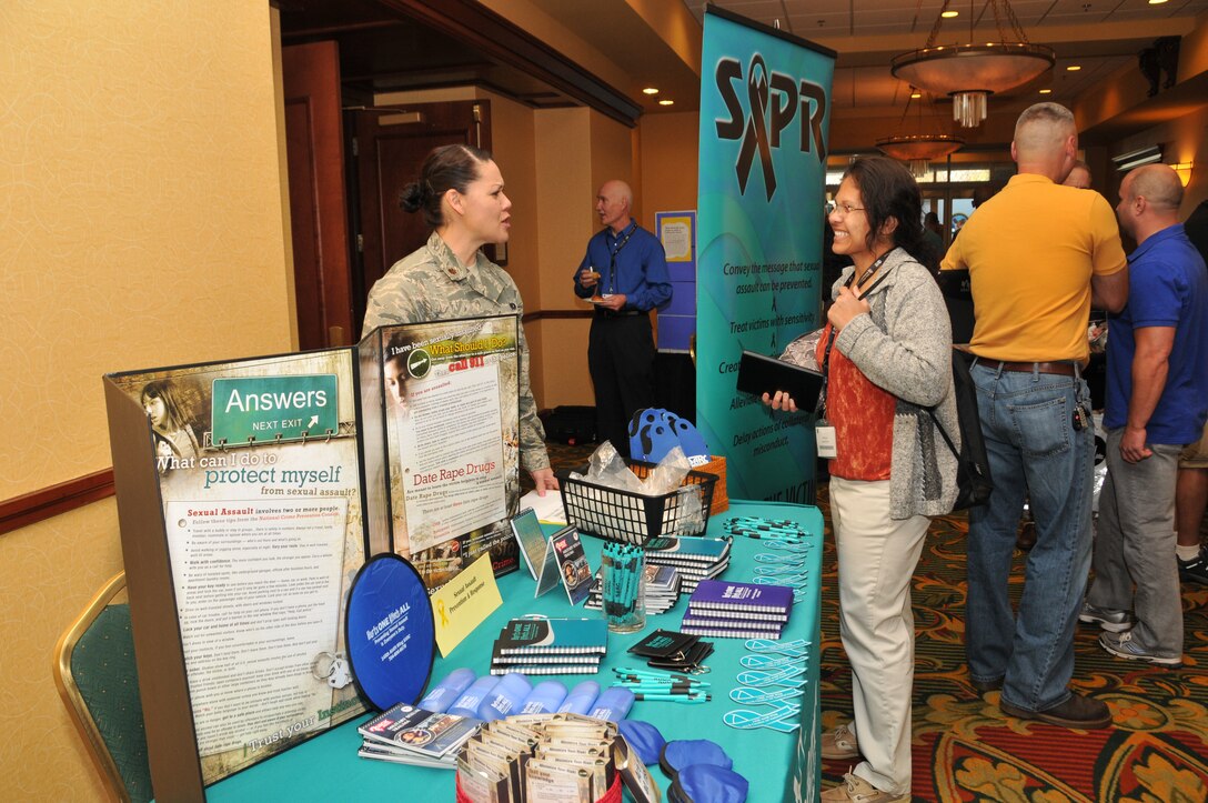 U.S. Air Force Maj. Karen Tedesco, Sexual Assault Response Coordinator for the North Carolina Air National Guard, hands out informational cards and brochures regarding sexual assaults and reporting options to NC Air and Army National Guard members during a Yellow Ribbon Reintegration Event. In the United States April marks Sexual Assault Awareness and Prevention Month. (U.S. Air National Guard photo by Master Sgt. Patricia F. Moran, 145th Public Affairs/Released) 