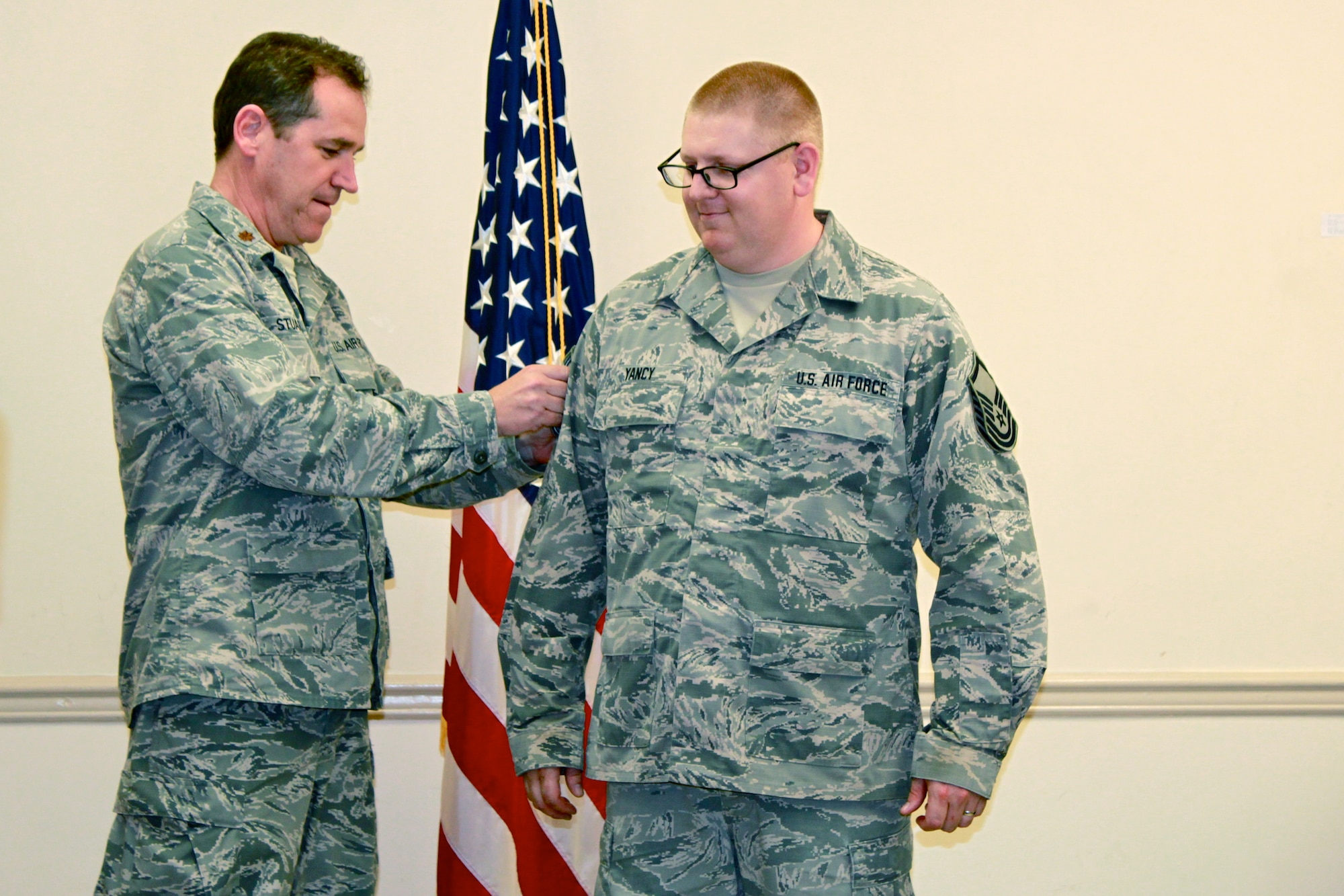 Tech. Sgt. Christopher Yancy, a mission capability technician for the 126th
Supply Chain Management Squadron attached to the 126th Air Refueling Wing,
receives his promotion to the rank of Master Sgt. from Maj. Doug Stuart, the
Public Affairs Officer for the 126th Air Refueling Wing, while temporarily
assigned to Joint Base Pearl Harbor-Hickam, Hawaii, April 15, 2014. Yancy
was at Joint Base Pearl Harbor-Hickam, Hawaii as part of a training exercise
with other members from the 126th Air Refueling Wing. The 126th Air
Refueling Wing is attached to the Illinois Air National Guard, based out of
Scott Air Force Base, Ill. (Courtesy photo) 