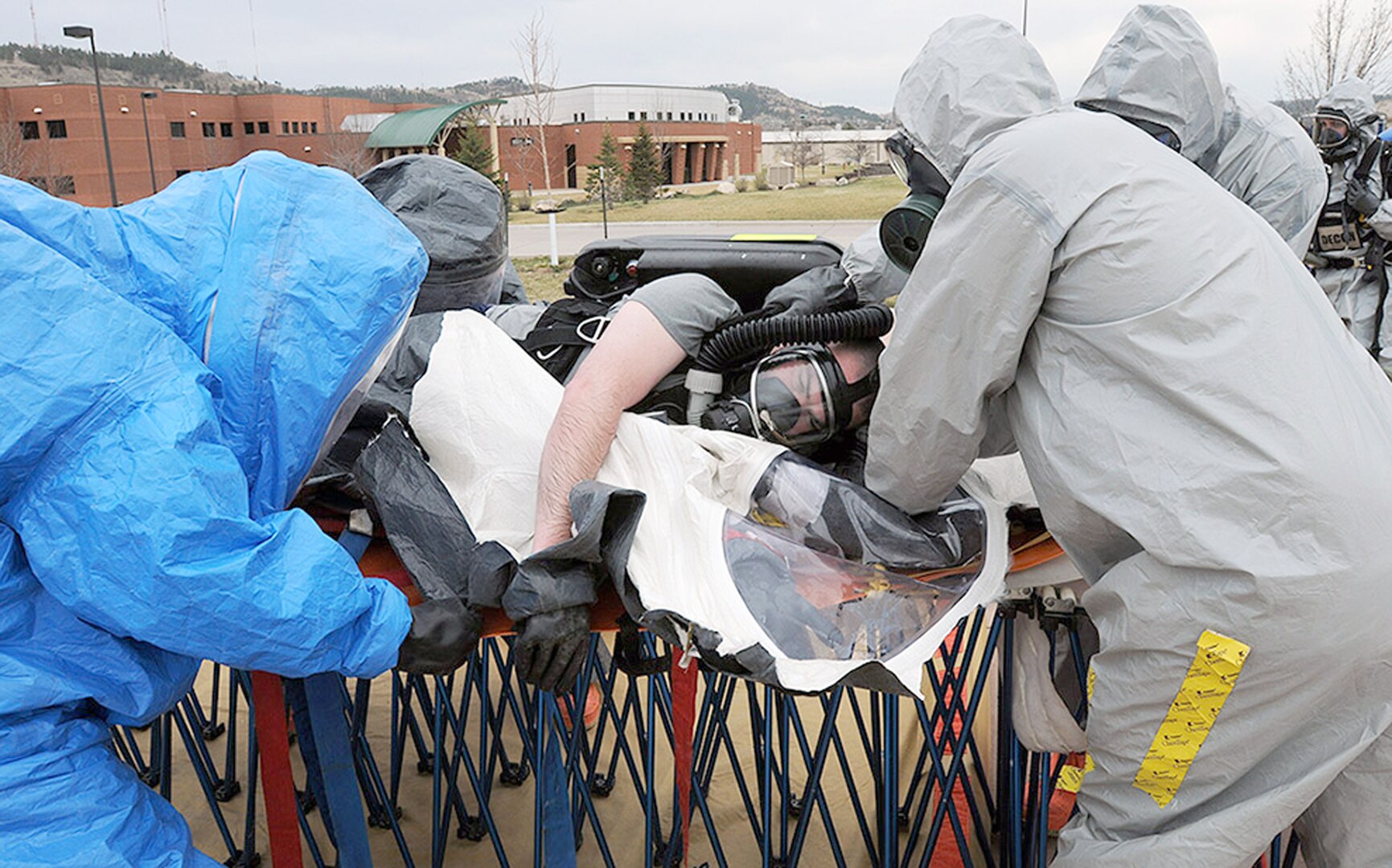 Members of the South
Dakota National Guard’s
82nd Civil Support Team
move mock injury patient
Army Spc. Robert Clausen
through the decontamination
process during a
training exercise April 22
at Camp Rapid in Rapid
City, S.D. The exercise,
facilitated by U.S. Army
North’s Civil Support Training
Activity, is designed
to test the unit’s ability
to respond to a chemical,
biological, radiological or
nuclear incident. The CSTA
is based out of Joint Base
San Antonio-Fort Sam
Houston.

Photos by Sgt. 1st Class Theanne Tangen