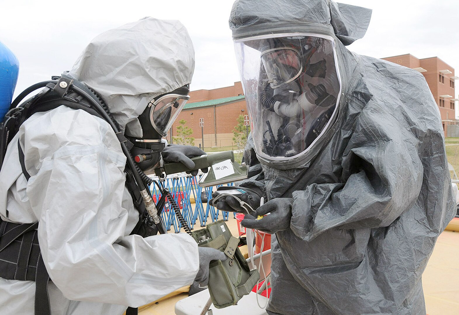 Army Sgt. 1st Class Marcia Hento (left) rehearses the process of decontaminating a camera used by Air Force
Tech. Sgt. Dustin Clement, both members of the South Dakota National Guard’s 82nd Civil Support Team,
during a training exercise April 22 at Camp Rapid in Rapid City, S.D. The exercise, facilitated by U.S. Army
North’s Civil Support Training Activity, is designed to test the unit’s ability to respond to a chemical, biological,
radiological or nuclear incident. The CSTA is based out of Joint Base San Antonio-Fort Sam Houston.